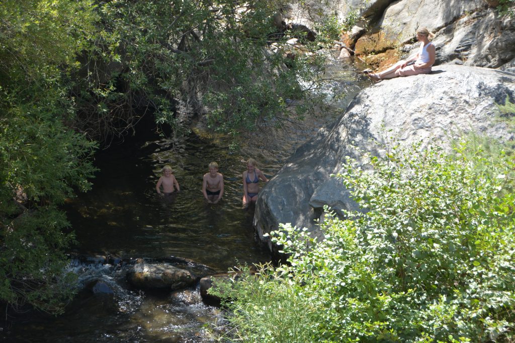 Guests bathing in the river below Busquistar, part of a lovely walk.