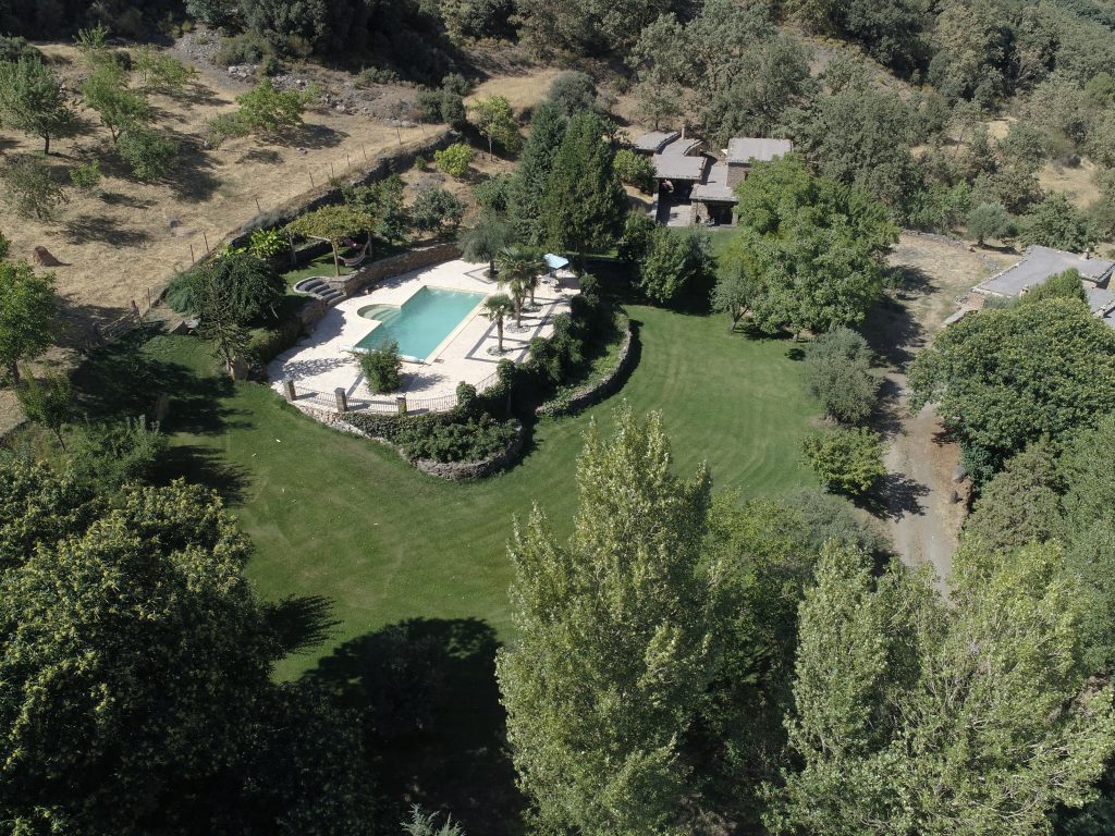 Aerial shot of cortijos rey fini showing the swimming pool and cortijos.